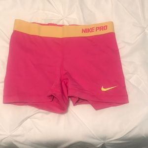 Pink and yellow Nike pro size medium